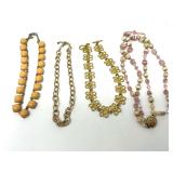 Group of Four Assorted Fashion Necklaces Featuring Beaded and Metallic Styles