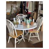 ROUND WHITE PEDESTAL TABLE W/ LAMINATE TOP (PIECE MISSING SEE PIC) 28" TALL X 41" ROUND & 3 WHITE WOOD WINDSOR STYLE CHAIRS 15" CHAIR HEIGHT X 37" TALL X 18" WIDE (DOES NOT INCLUDE CONTENTS)