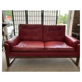 MID CENTURY MODERN RED VINYL LOVESEAT W/ WOOD FRAME 35" WIDE X 58" LONG X 30" TALL