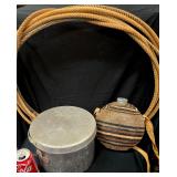 Collection of Vintage Aluminum Camping Cookware, Nesting Pots, a Canteen with a Burlap Patterned Fabric Cover, Nesting Plastic Plates and Cups, and a Brown Cowboy Lariat