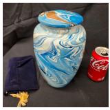 NEW- Adult Cremation Urn Featuring A White, Blue, and Brown Marbled Swirl Pattern. Includes A Felt Cloth Carrying Bag