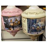 Set of 2 Thomas Kinkade Heirloom Glass Ornaments produced by The Bradford Editions (part of The Bradford Exchange) around 2000–2001.