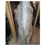 ALL BED LINENS, HAND CROCHETED AFGHANS, AND MORE HANGING ON ROD MARKED 3175