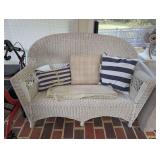 WHITE WICKER LOVESEAT SETTEE WITH DECORATIVE PILLOWS AND THROW BLANKET