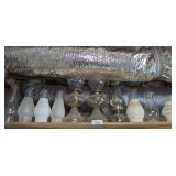 VINTAGE OIL LAMPS AND CHIMNEYS ON TOP SHELF MARKED 3054