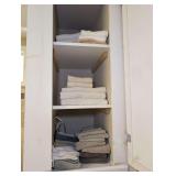 CONTENTS OF BATHROOM CABINET MARKED 1168b INCLUDING TOWELS, WASHCLOTHS, AND EXTENSION CORD