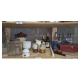 ALL ITEMS IN SHELF SECTION MARKED 3056 INCLUDING DECORATIVE SEGMENTED BOX, PLATE STANDS, VINTAGE LIQUOR BOTTLES WITH TAX STAMPS, FORMAL GLASS CANDY DISH, MUSICAL SNOW GLOBES , AND MORE