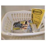 LAUNDRY BASKET AND CONTENTS INCLUDING SHOP-VAC FILTERS, OLD FIRECRACKER SIGN, HOLDING TANK DEODORANTS, METAL GRAB BARS, AND MORE