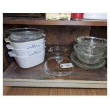 CORNING WARE BLUE CORNFLOWER CASSEROLE DISHES AND PYREX GLASS MIXING BOWLS ON ISLAND SHELF MARKED 1209