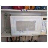 BAIL LID GLASS SPAGHETTI STORAGE JAR AND GE TURNTABLE MICROWAVE OVEN ON SHELF MARKED 1199