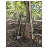 ALL ITEMS IN CARPORT CORNER MARKED 4021 INCLUDING VINTAGE METAL BODY WHEELBARROW, GARDEN RAKE, GARDEN HOE, AND OPTIONAL PVC TUBE