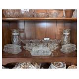 ALL FORMAL GLASS SERVING PIECES AND JARS ON SHELF MARKED 1025 - DINE