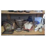 ALL ITEMS ON LOW SHELF MARKED 2018 INCLUDING DECORATIVE ART GLASS BIRD FEEDER, CERAMIC TEAPOT IN ORIGINAL BOX, POTS/PANS, LARGE BLUE GLASS BAIL LID STORAGE JAR, AND MORE