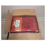 BOX OF FACTORY SEALED TABLECLOTHS, TOWELS, TABLE LINENS, AND MORE