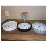 THREE STERLING & NOBLE CLOCK COMPANY WALL CLOCKS PLUS VINTAGE COFFEE JAR WITH COIN SLOT - BR1