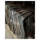 LARGE LOT OF CAST IRON ANTIQUE FIREBOX SURROUNDS - 13 TOTAL SURROUNDS