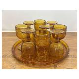 DR… Vintage Tiara Exclusives drink set, “Sandwich” pattern, includes nine amber stemmed glasses, and amber glass serving tray, believed to be vintage Indiana glass. Matches lot 2032. See picture