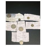 Collection of World Silver Coins with Handwritten Notes Including British Half Crown, Shilling, and Canadian Ten Cents