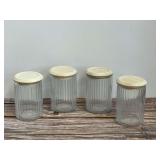 Set of Four Ribbed Glass Storage Jars with Wooden Lids