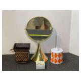 Assorted Home Decor and Novelty Items Including Tabletop Mirror and Dunkin Container