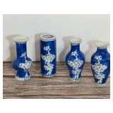 Set of Four Blue and White Ceramic Miniature Vases with Floral Motif