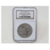 1986-S LIBERTY ELLIS ISLAND SILVER DOLLAR COIN, NGC GRADED PF69 ULTRA CAMEO