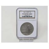 1986-S LIBERTY ELLIS ISLAND SILVER DOLLAR COIN, NGC GRADED PF69 ULTRA CAMEO