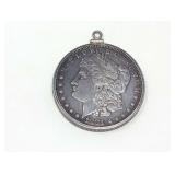 1881-O MORGAN SILVER DOLLAR COIN IN PENDANT SURROUND