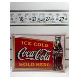Ice cold Coca Cola sold here sign