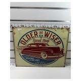 Older and wiser speed shop sign