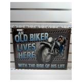 An old biker lives here sign
