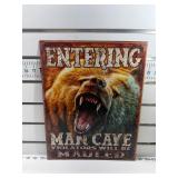 Entering man cave bear sign