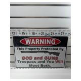 Warning god and guns sign