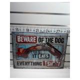 Beware of dog it eats everything shot sign