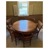 Solid oak round dining table with 6 chairs