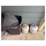 Propane tanks and outdoor trash can
