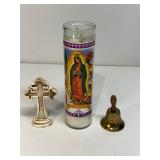 Bell, cross and religious candle