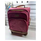 Used pink carry-on roller luggage bag