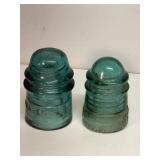Pair of vintage green glass insulators