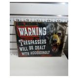 Warning, trespassers, dealt with accordingly sign