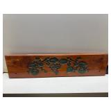 Wooden plaque with grape engraved