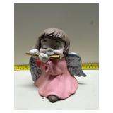 Vintage angel playing flute figure