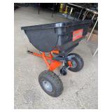 Tow behind seed spreader cart