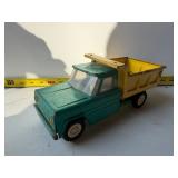 Green and yellow vintage toy dump truck