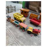 Large lot of wooden toy trains and vehicles