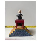 Magical cast iron coin bank