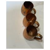 Three solid copper Moscow Mule mugs by West Bend
