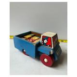 Wooden dump truck with wooden letter blocks