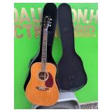 Vintage acoustic guitar and case