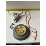 vintage items: portrait, necklace, steer skull.